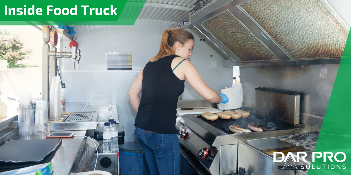 woman inside food truck kitchen